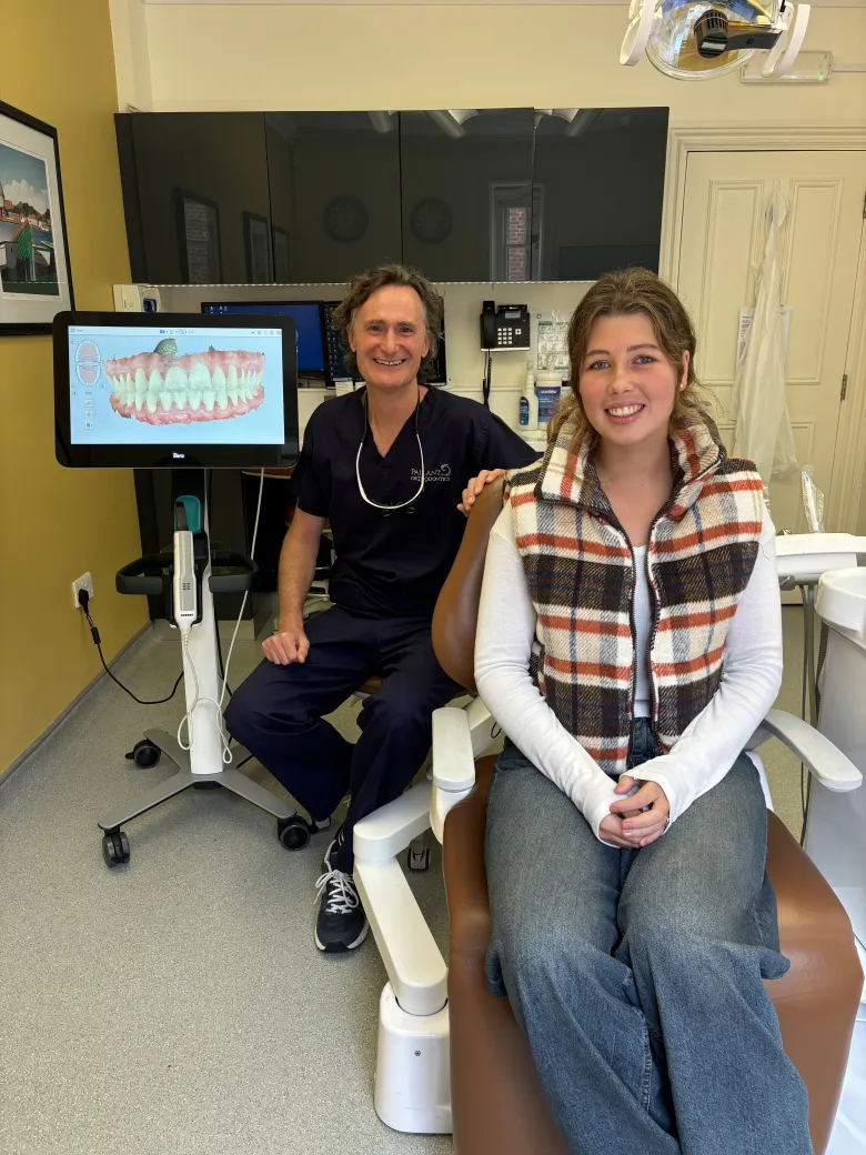 Dr Alastair with a young patient reviewing a digital scan at Pallant Advanced Dentistry