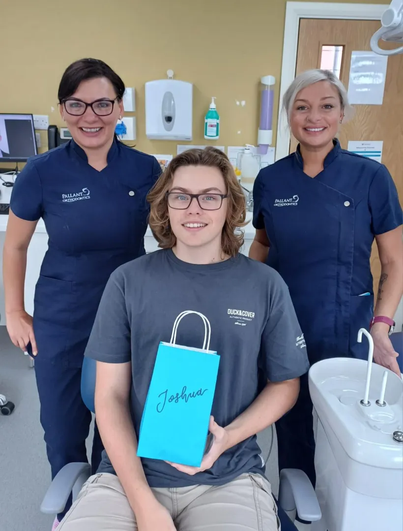 A teenage patient celebrating the end of treatment with the Pallant team